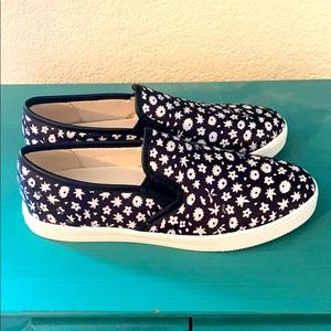 Brand new, never worn Coach floral slip ons!